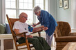 © Raymond Forbes LLC/Stocksy - Senior Veteran home medical Check up for blood pressure