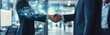 © SKIMP Art - Businessmen shaking hands in an office with digital graphs and business growth icons floating around them, symbolizing success through technology integration Generative AI