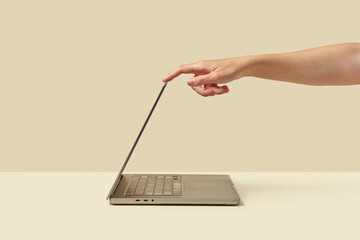 Person switching computer into sleeping mode while shutting down