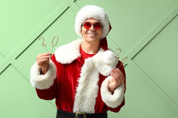 Sticker - Santa Claus with figure 2024 on green background