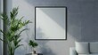 © Ziyan Yang - White blank poster with frame mock-up on grey wall.