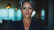 © Vertigo Images - Confident woman with short gray hair in a black blazer.