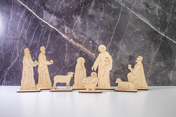 Christmas Manger scene with figurines including Jesus, Mary, Joseph and sheep