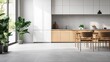© Maria Mikhaylichenko - Modern minimalist kitchen with sleek white cabinets and warm wood accents, featuring a dining area and large potted plants by a window for a touch of nature.