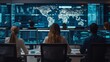 © saokaew - A control room setting with analysts monitoring data on multiple screens displaying global information and graphs.