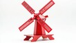 © Rangga Bimantara - A vibrant red model windmill with detailed blades, showcasing traditional design and craftsmanship.
