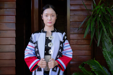 Fashionable portrait beautiful girl. Hill tribe clothing has been redesigned to suit the current era and modern city people's lifestyle.