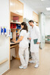 © Santi Nuñez/Stocksy - Medical staff working at nurse station
