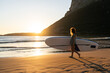 © Alvaro Lavin/Stocksy - Woman with SUP board.