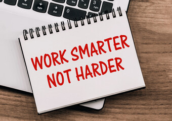 Work Smarter Not Harder Written On Notebook With Laptop