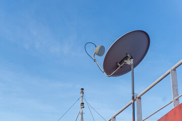 TV satellite antenna on the ship deck. Satellite tv receiver.