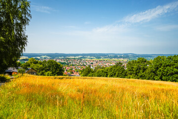 View of the green landscape and the city from the Rehberg near Kulmbach.
