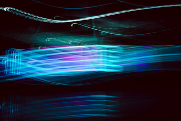 Wall Mural - a blue and purple light show with a dark background. the light show is very dynamic and has a lot of