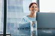 © Jacob Lund - Young female professional sits in an online business meeting