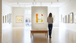 © Worakit - woman exploring art gallery, admiring paintings on display. bright and spacious environment enhances her appreciation for artwork