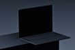 © Goashape-Studio - Black Laptop Minimalist Mockup: A sleek, black laptop with a blank screen sits on a dark surface, providing a clean and modern canvas for your design or message.