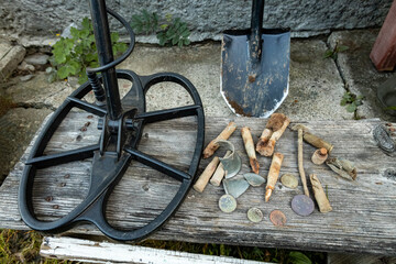 Wall Mural - The result of searching for coins using a metal detector and a shovel.