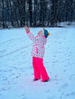 © Irina Schmidt - Funny Little Girl Having Fun in Beautiful Winter Park. Happy school child playing with snow, happiness about snowfall and winter activities.