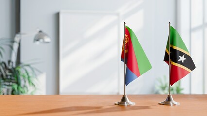 FLAGS OF ERITREA AND SAINT KITTS ON TABLE