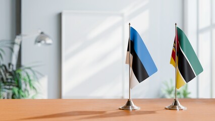 FLAGS OF ESTONIA AND MOZAMBIQUE ON TABLE