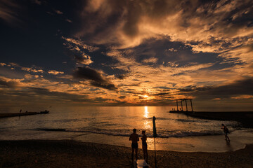 beautiful warm sunset on the sea coast