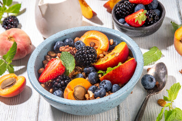 Granola breakfast with fruit and berry