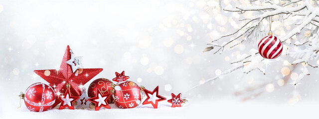 Wall Mural - winter panoramic nature landscape with christmas decoration of red stars and balls on snowy backgrou