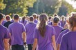 © LadiesWin - A group of people wearing purple shirts at a charity walk for IBD awareness