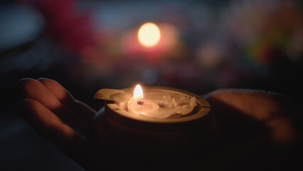  Hand With Small Diwali Candle