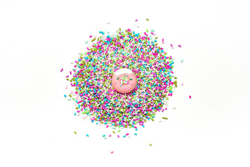 Miniature pastel pink donuts sprinkled with blue green purple pink sprinkles on white background for discount announcement or birthday celebration design or commercial advertisement