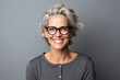 © Igor - Portrait of a happy mature woman with grey hair and eyeglasses
