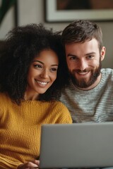 Wall Mural - A couple sitting on a couch together, looking at a laptop