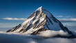 © janzwolinski - Majestic snow-covered mountain peak shrouded in ethereal clouds at sunrise with blue sky background.