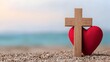 © NKCoolper - Wooden Christian cross and red heart symbolizing divine love and spiritual redemption sit on a gravel covered ground