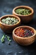 © Fotograf - Three wooden bowls containing different types of spices