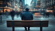 © 69 - A man sits quietly on a city bench while the world moves around him in a blur, creating a feeling of loneliness in a bustling urban environment.