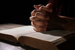 © New Africa - Man with Bible praying at wooden table, closeup