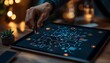 © AhmadTriwahyuutomo - A person draws on a digital tablet displaying a complex network design, illuminated by warm ambient light in a cozy setting.