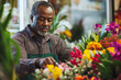 © Krisz G - African American man designing floral arrangements in a floral shop
