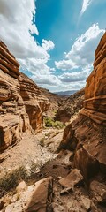 Wall Mural - Stunning Canyon Landscape with Blue Sky and White Clouds