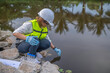 © reewungjunerr - Environmental engineers inspect water quality,Bring water to the lab for testing,Check the mineral content in water and soil,Check for contaminants in water sources.