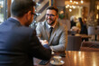 © Dorde - Professional Handshake Between Businessmen in Cafe