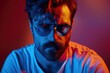 © Anjali - Serious man model with mustaches and beard in neon light portrait