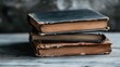 © Dulemegapixel - An artfully arranged stack of vintage books showcases their aged beauty and timeless literary charm, hinting at stories waiting to be discovered within.