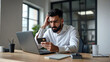 © Gokul - Frustrated Young Man at Desk with Laptop and Credit Card