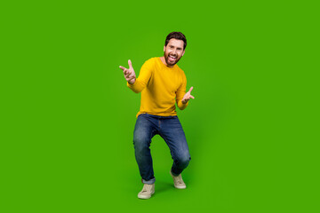 Sticker - Full size photo of pretty young male dance have fun disco wear trendy yellow outfit isolated on green color background