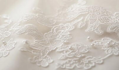 A close up of a white lace with flowers and pearls