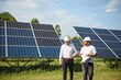 © Serhii - Indian engineer and businessman planing new ecology project. around solar panel
