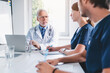 © InsideCreativeHouse - Group of medics during briefing in clinic boardroom