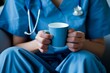 © LadiesWin - A nurse enjoying a quiet cup of coffee during a break